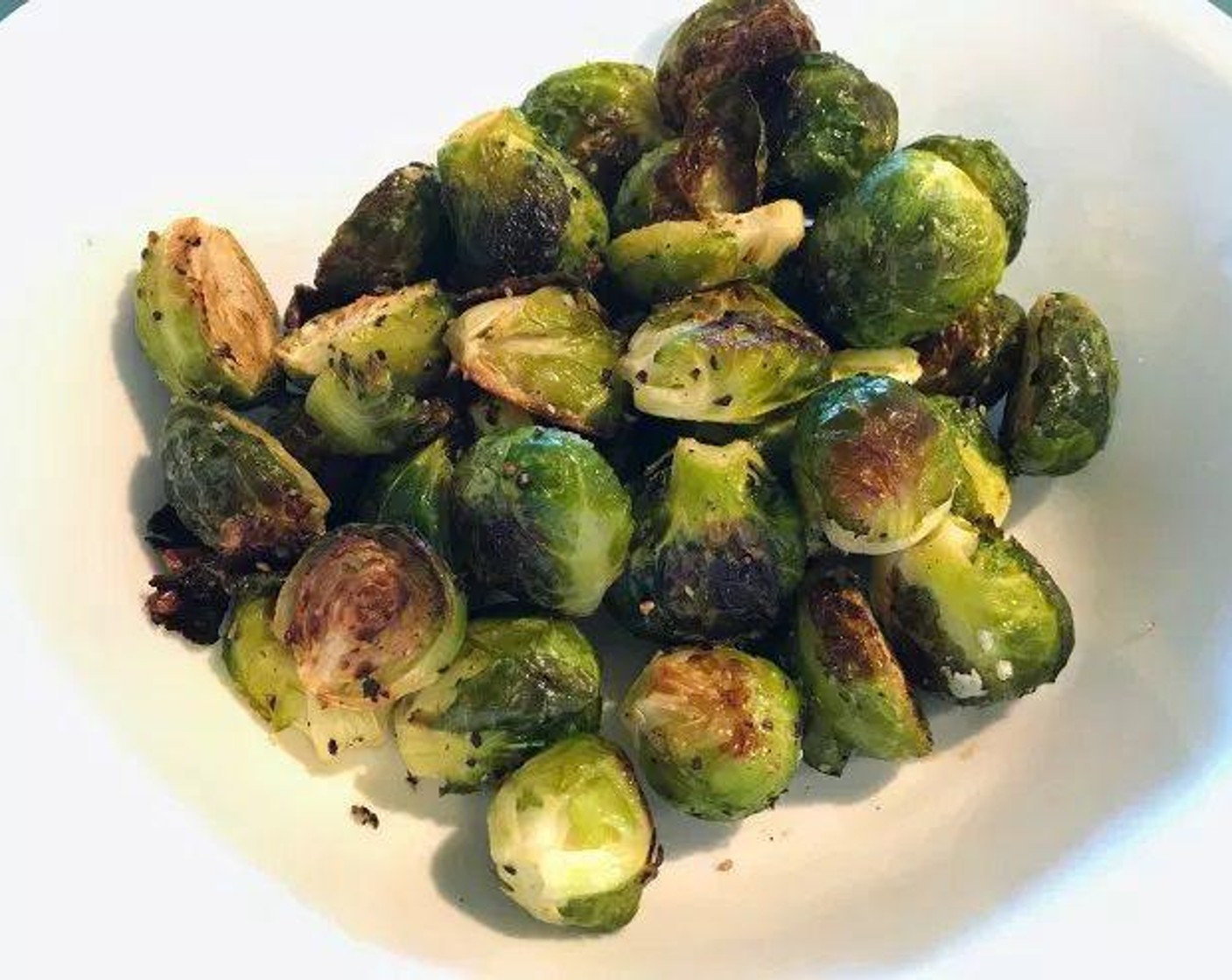 step 3 Add Extra-Virgin Olive Oil (1 Tbsp), Salt (1/4 tsp), and Coarse Black Pepper (1/2 tsp) to the Brussel sprouts. Mix until evenly coated. Bake for 25 minutes, stirring every 5 to 10 minutes.
