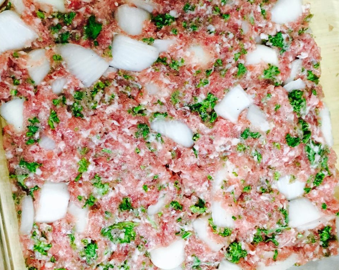 step 2 Grease a 40cm baking dish. Place meat mixture in the baking dish, covering the bottom, and pat down until smooth.