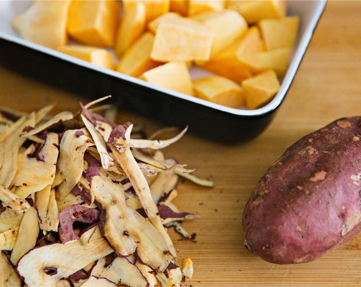 step 2 Peel Sweet Potatoes (4), chop into eighths and place in an oven-proof dish.