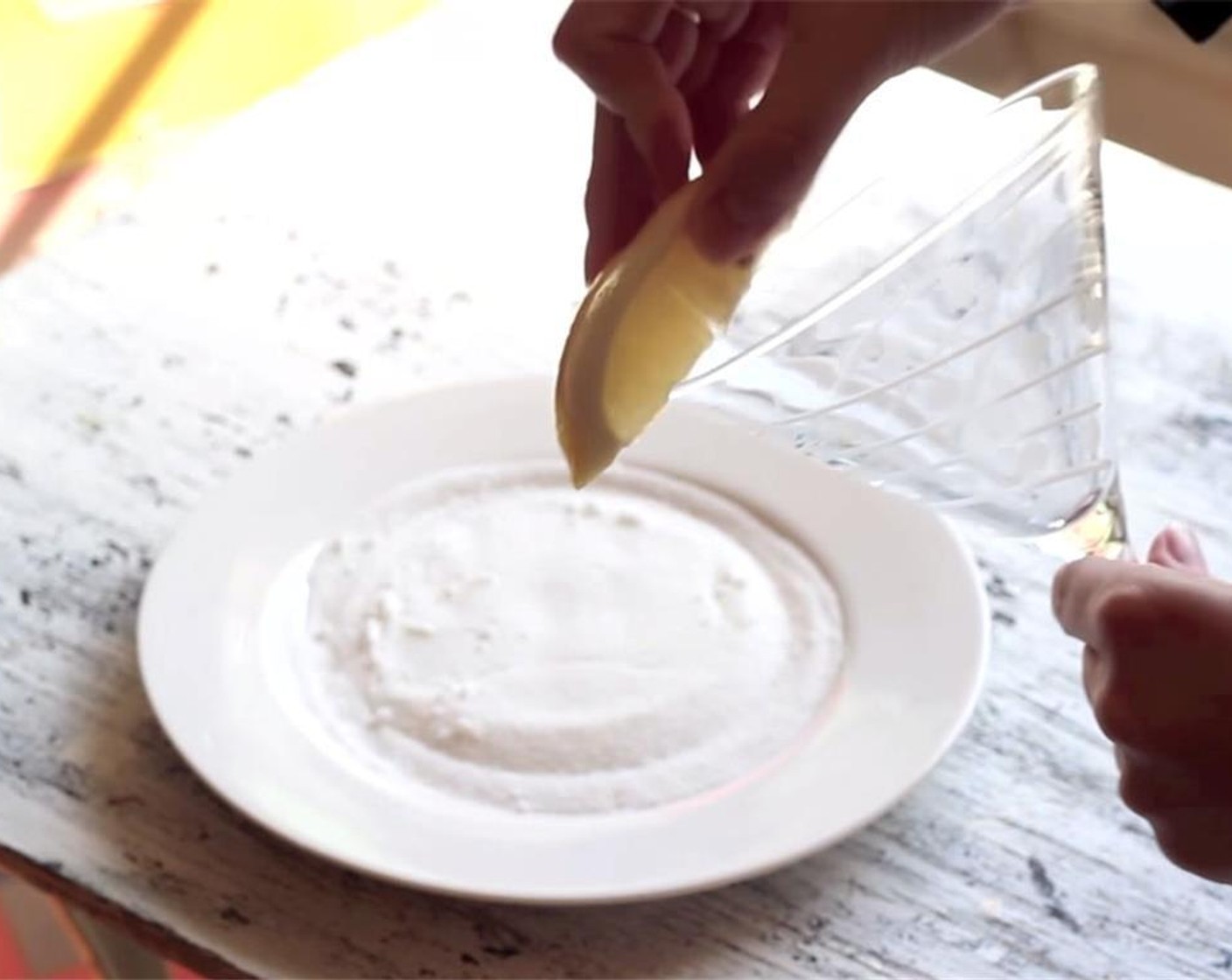 step 1 Rub the rim of your martini glass with a lemon wedge cut from the Lemon (1). Pour some Granulated Sugar (to taste) onto a plate, and dip the rim of the glass into the sugar. Set aside.