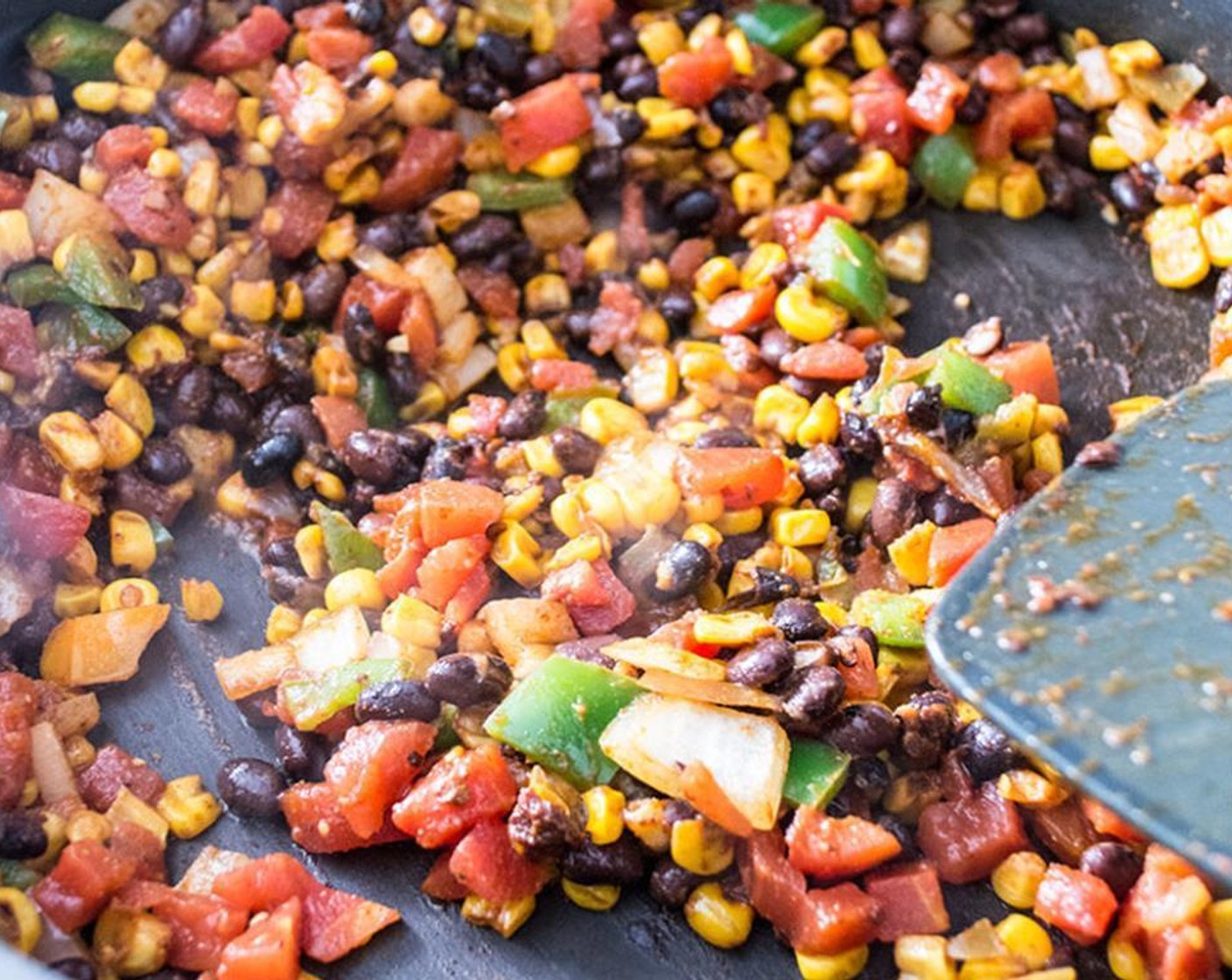 step 6 Stir in seasoned corn, Canned Black Beans (1 cup), and Canned Diced Tomatoes with Green Chilies (1 cup) and cook for 5-7 minutes or until beans and tomatoes are heated through and all seasonings and flavors are well combined.