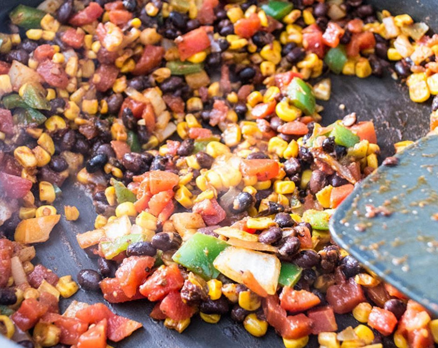 step 6 Stir in seasoned corn, GOYA® Black Beans (1 cup), and Canned Diced Tomatoes with Green Chilies (1 cup) and cook for 5-7 minutes or until beans and tomatoes are heated through and all seasonings and flavors are well combined.