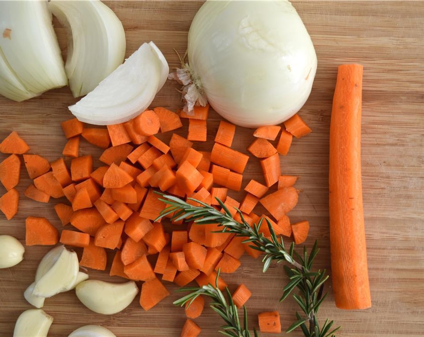 step 2 Chop the Onion (1), dice the Carrots (2) and roughly chop the Garlic (5 cloves).