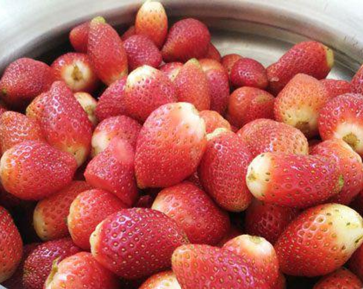 step 1 Wash Fresh Strawberries (10 cups) and let it dry. Chop each to four pieces. Take warm Water (1/3 cup) and add little sugar and add the Instant Dry Yeast (1 tsp) and mix well and let it to rise for some time.