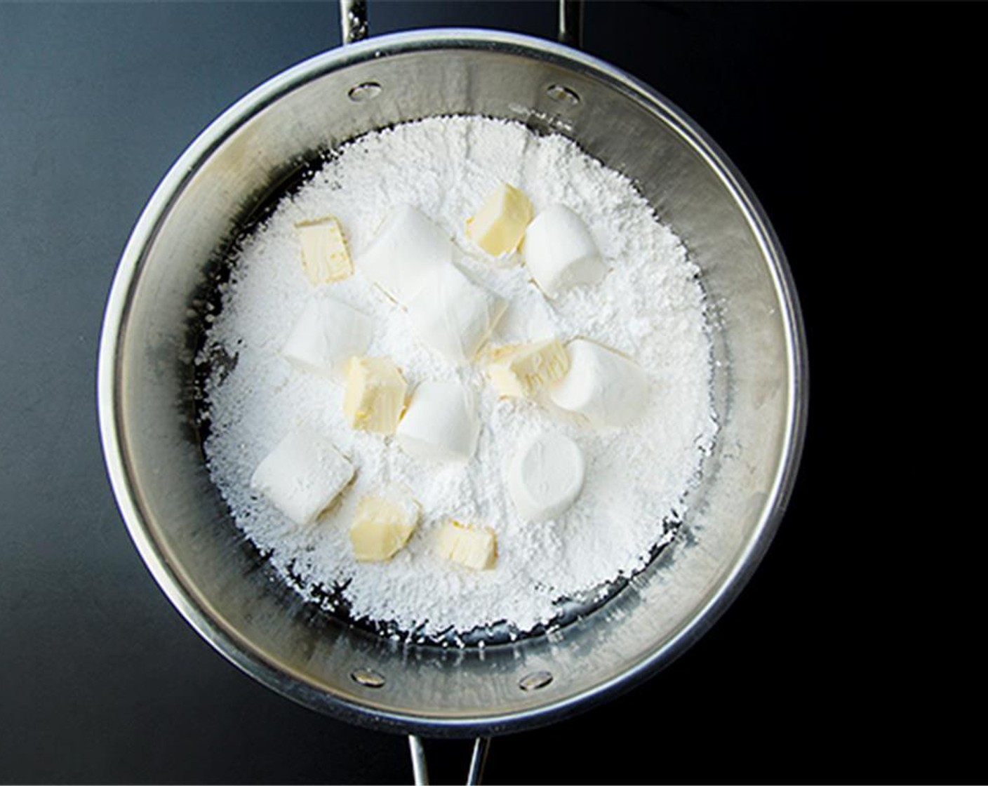 step 1 In a saucepan over medium heat, combine the Light Corn Syrup (3/4 cup), Butter (1/4 cup), Water (1/2 Tbsp), Powdered Confectioners Sugar (2 1/2 cups) and an additional 2 tablespoons  and Marshmallow (1 cup).