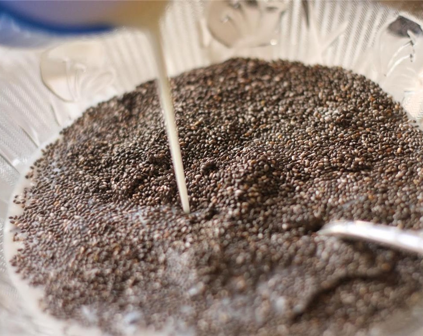 step 1 Put Chia Seeds (1/2 cup) in a bowl, and pour in Unsweetened Almond Milk (1 1/2 cups).