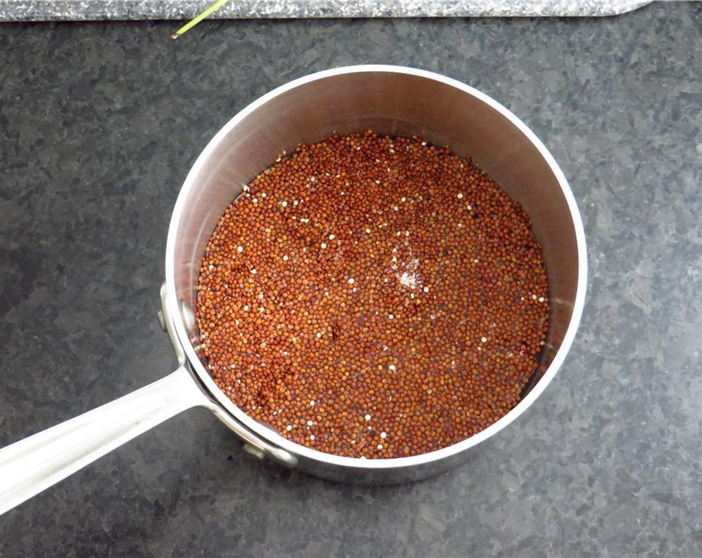step 2 In a small saucepan, combine Quinoa (1/2 cup) and Water (1 cup) and bring to a boil. Reduce heat to a simmer, cover, and cook for 15 minutes. Remove from heat, and take off lid to allow quinoa to cool.