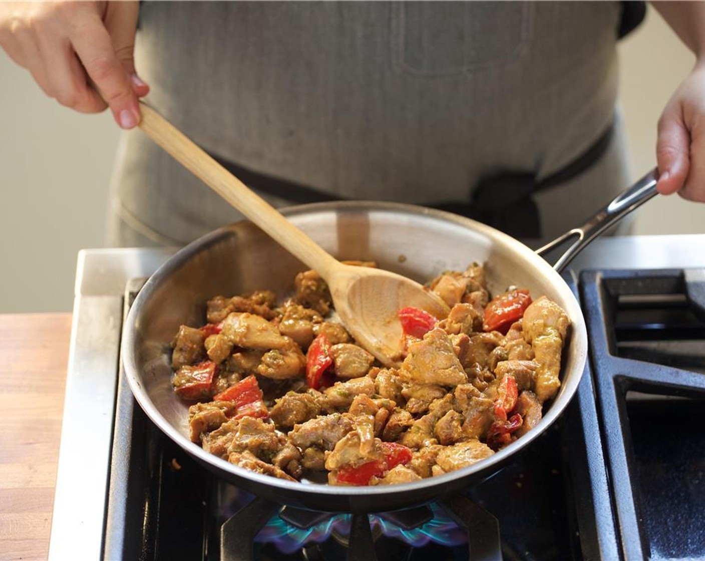 step 9 Add the Coconut Milk (1/2 cup) and lower heat to medium low. Cook for 7 minutes, stirring occasionally. Remove chicken from heat and set aside until plating.