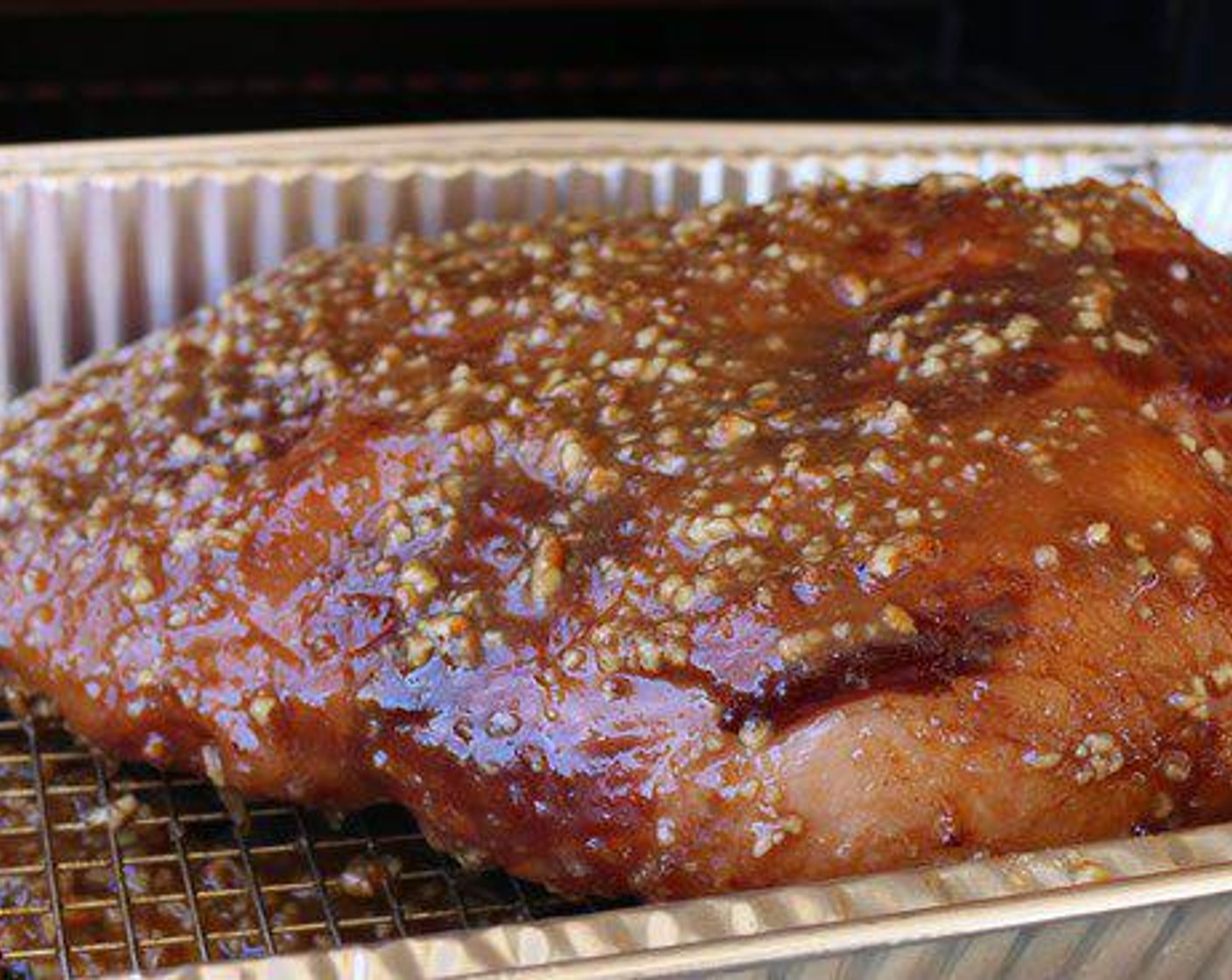 step 6 Brush bourbon praline glaze over ham when internal temperature reaches 130 degrees F (54 degrees C). Continue to cook for 20 more minutes or until internal temperature reaches 140 degrees F (60 degrees C).