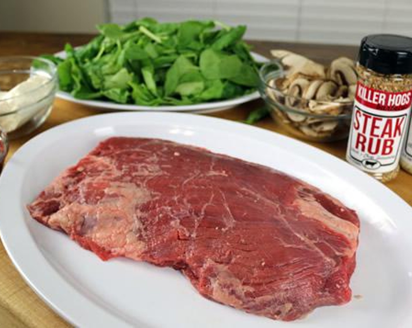 step 2 Butterfly the Flank Steak (2.5 lb) by making a thin cut completely down the length of the steak (should open like a book and lay flat).