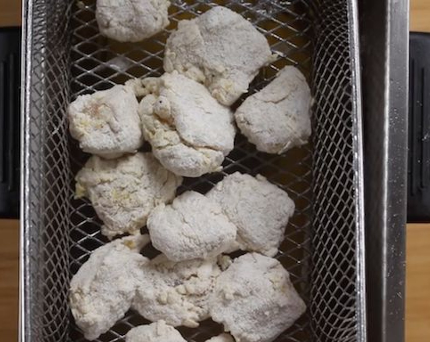 step 5 Transfer the coated chicken chunks to a fryer or deep pot with Vegetable Oil (as needed) set to 350 degrees F (180 degrees C).
