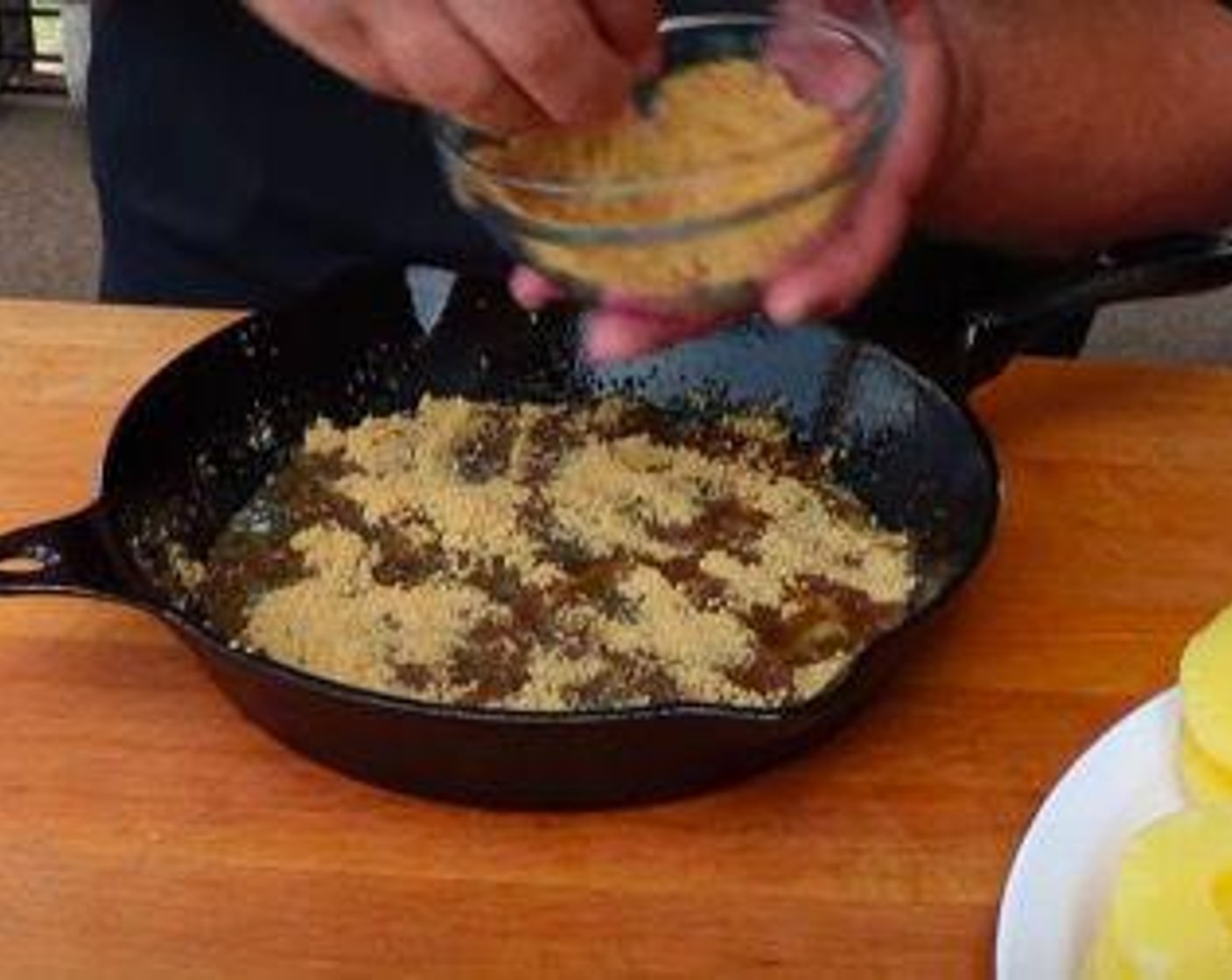 step 2 In a medium size iron skillet add melted Butter (1/2 stick). Swirl the skillet so the butter costs the sides and bottom evenly. Sprinkle Brown Sugar (3/4 cup) around the bottom of skillet.