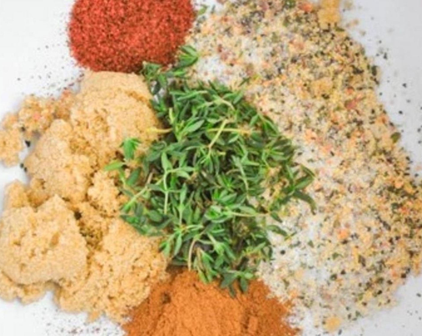 step 2 For The Marinade: Add Dry Italian Salad Dressing Mix (1 packet), Ground Cinnamon (1 tsp), Fresh Thyme Leaves (1 Tbsp), Chili Powder (1/2 tsp), and Brown Sugar (2 Tbsp) in a big mixing bowl.