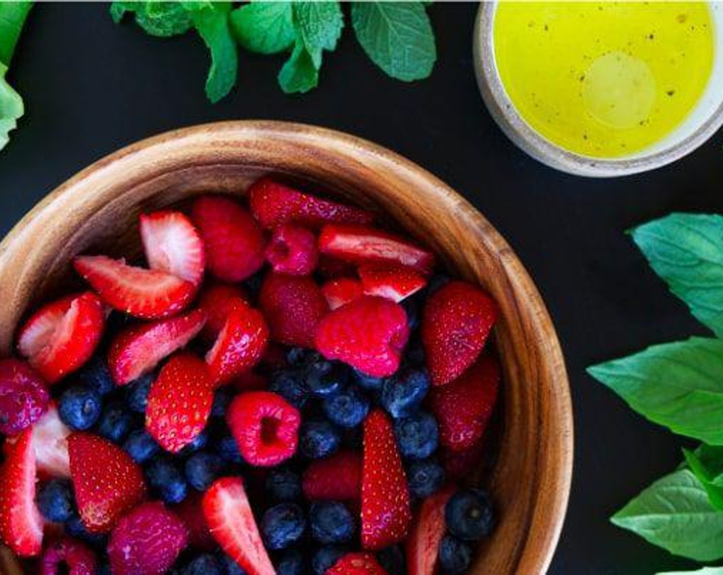 step 4 Mix the Fresh Blueberries (2 cups), Fresh Raspberries (2 cups), Fresh Strawberries (1 1/2 cups), Fresh Mint Leaves (2 Tbsp), and Fresh Basil Leaves (2 Tbsp) in a bowl with the mint and basil. Drizzle with the dressing. Toss to coat.