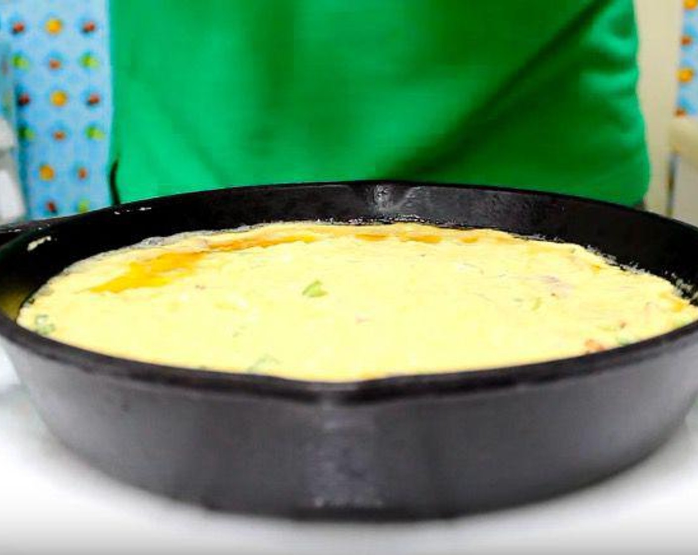 step 6 Transfer mixture to hot cast-iron skillet. Bake at 375 degrees F (190 degrees C) for 30 minutes, or until a toothpick inserted into the center comes out clean.