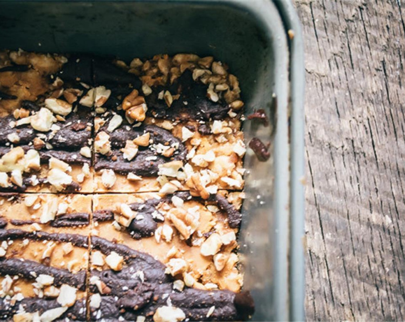 step 8 Rinse sauce pan, then add Semi-Sweet Chocolate Chips (1/2 cup) and repeat same process as butterscotch, add milk again if needed, once chocolate has melted, drizzle over butterscotch layer.