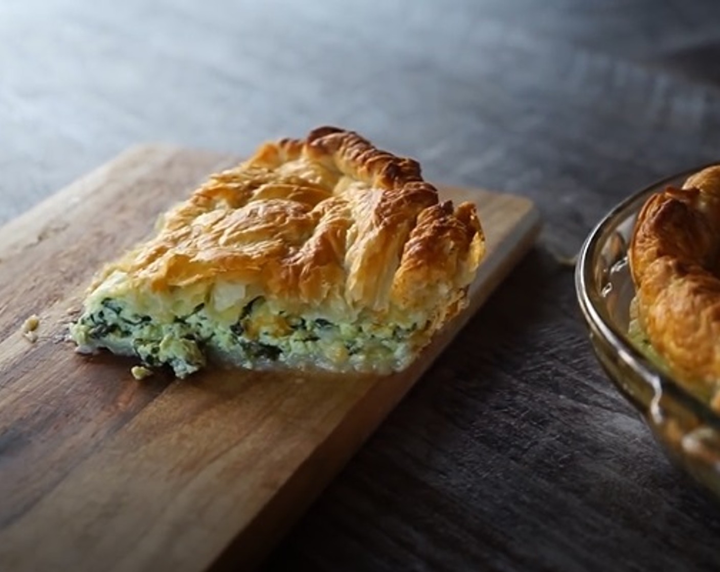 step 14 Let the spinach ricotta pie rest and cool for up to ten minutes, then slice into triangular serves and place on a wooden board. Enjoy!