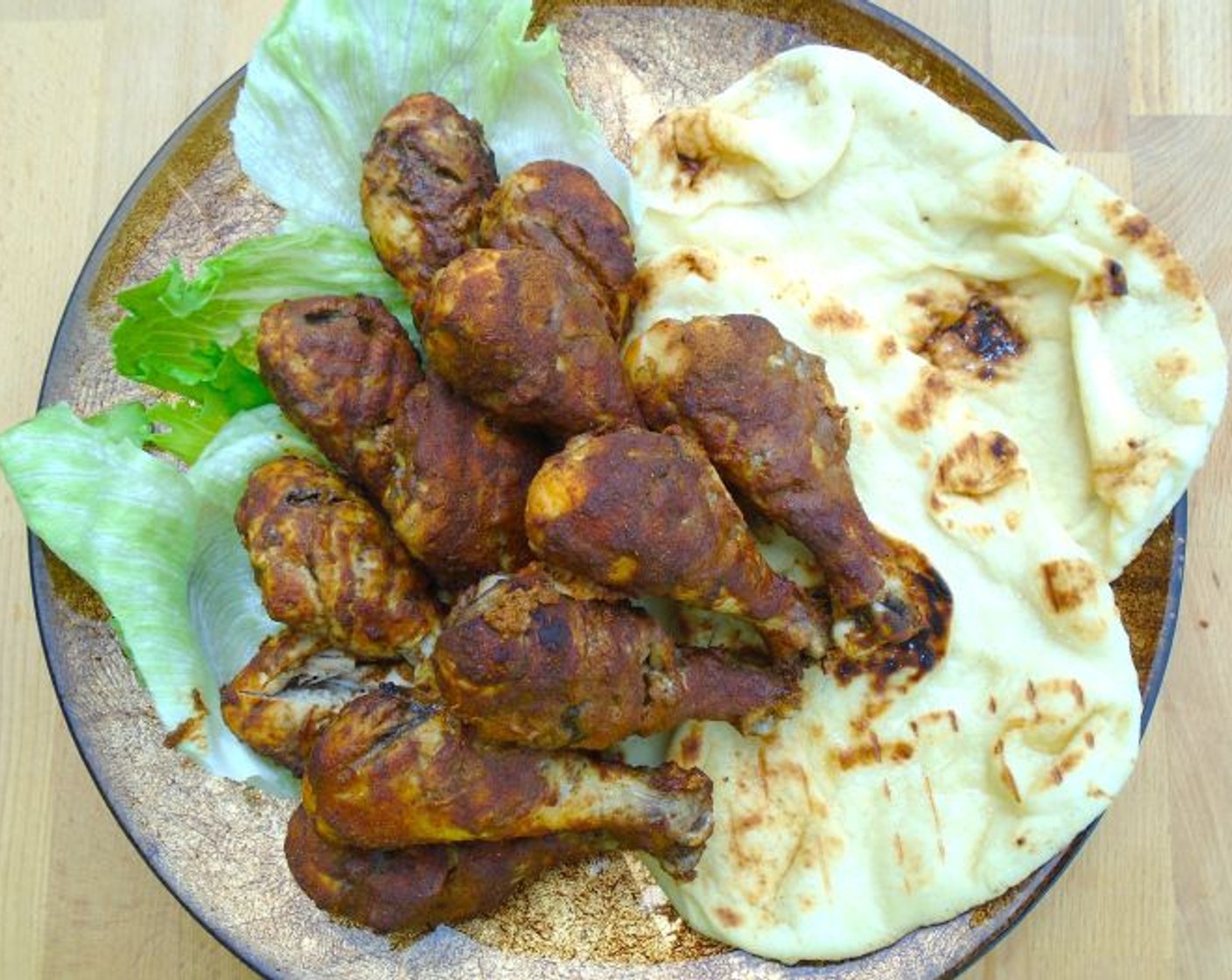 step 7 Plate chicken with Naans (to taste) and Iceberg Lettuce (to taste).