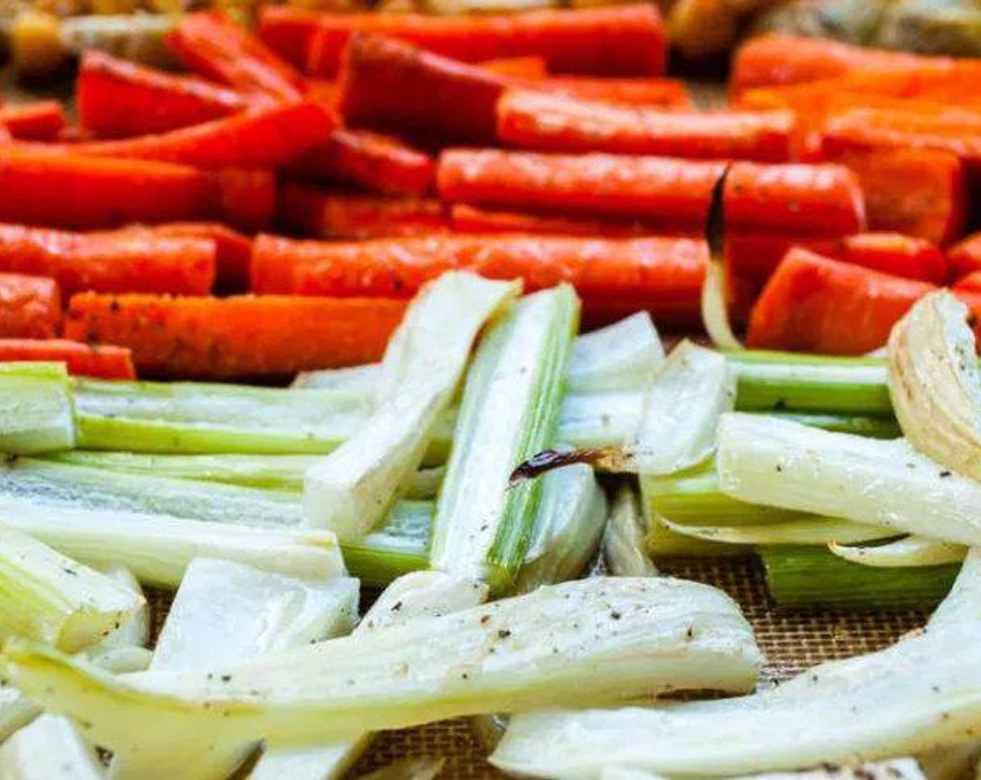 step 3 Spread Carrots (4), Cauliflower (1/2 head), Red Chili Pepper (1/2), Fennel Bulb (1), Red Onion (1/2), and Garlic (2 cloves) in a single layer on a large baking sheet. Drizzle with Olive Oil (1/4 cup) and season with Salt (to taste) and Ground Black Pepper (to taste).