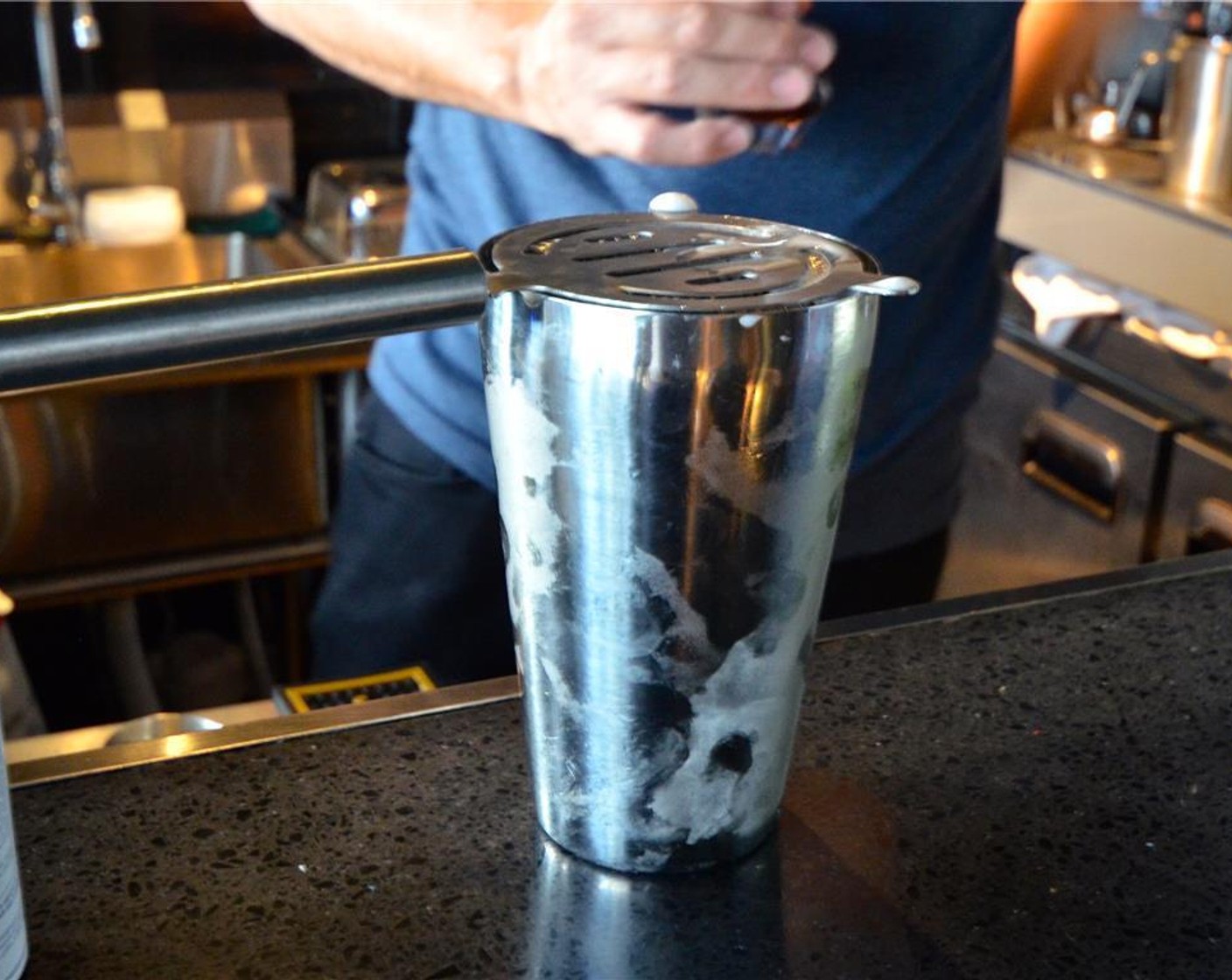 step 5 Discard the ice inside the glass that was set aside and prepare your strainer.