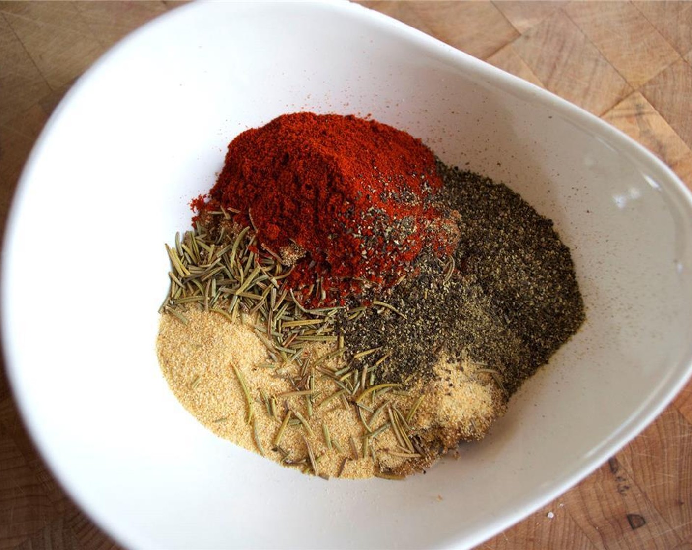 step 4 Combine the Salt (2 Tbsp), Brown Sugar (2 Tbsp), Garlic Powder (2 Tbsp), Ground Black Pepper (1 Tbsp), Paprika (1 Tbsp), and Fresh Rosemary (1 tsp) in a bowl.
