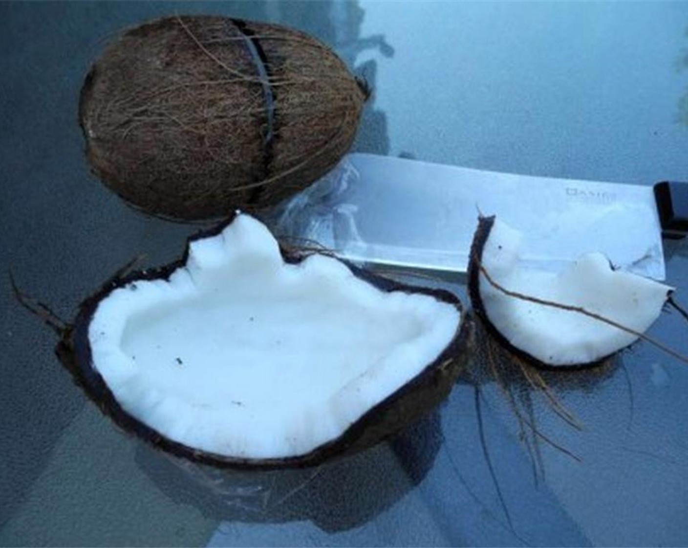 step 1 Discard the hard shell part of the Coconut (1).