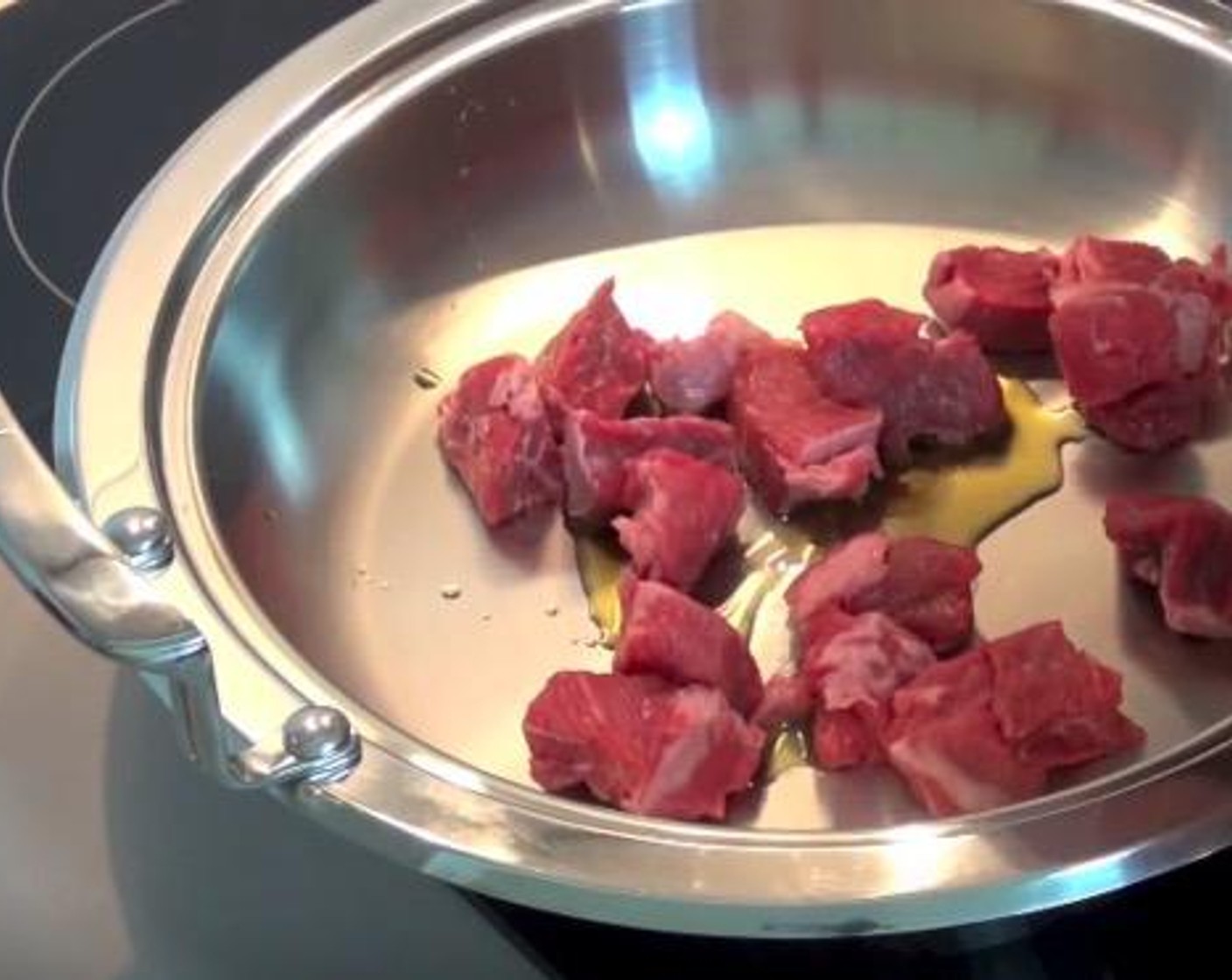 step 1 In a tagine or heavy-based saucepan, add Olive Oil (as needed). Brown Beef Chuck (1.5 lb) in batches and transfer to a bowl as finished.