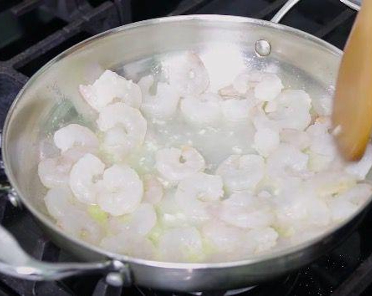 step 1 In a large pan over medium heat, add Butter (2 Tbsp) and allow it to melt. Add Garlic (1 clove) and the Shrimp (1 lb). Cook until shrimps are pink on both sides, about 3 minutes. Set aside.