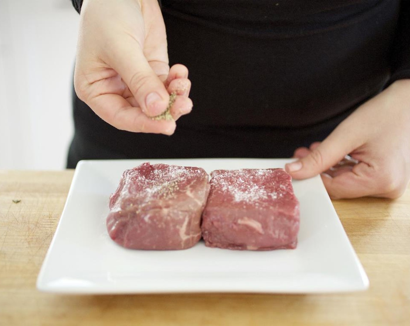 step 8 Pat dry the Sirloin Steak (2) with paper towels. Season each side with Salt (1/4 tsp) and Ground Black Pepper (1/4 tsp).