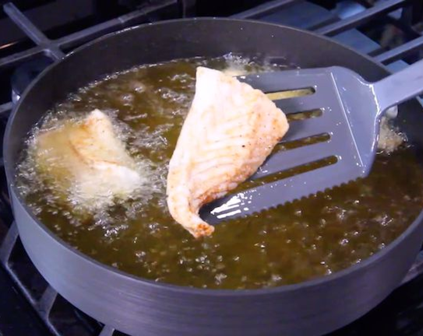 step 4 In a large nonstick pan over medium-high heat, heat Vegetable Oil (1/2 Tbsp). Remove the cod from the marinade and season both sides of each filet with Kosher Salt (to taste) and Freshly Ground Black Pepper (to taste). Place the fish on the pan, flesh side down. Cook until the fish is opaque and cooked through, 3 to 5 minutes per side. Let rest for about 5 minutes before flaking the fish with a fork.