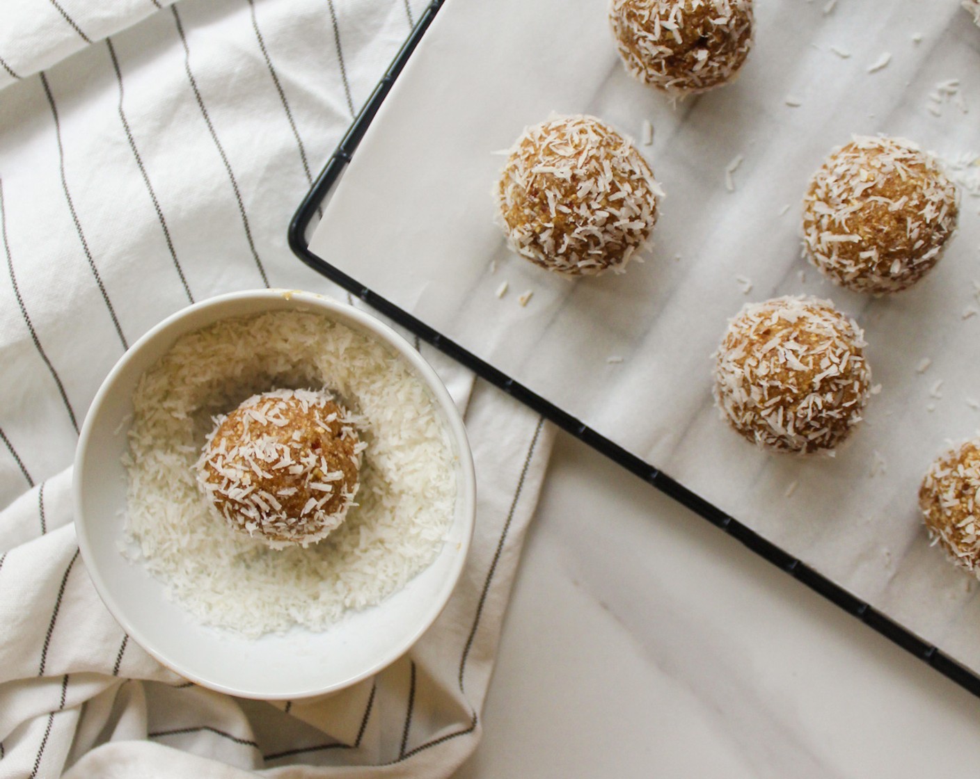 step 4 Portion out a heaping tablespoon of dough and roll it into a ball, then roll it in some extra coconut. Repeat until the dough is all used up.