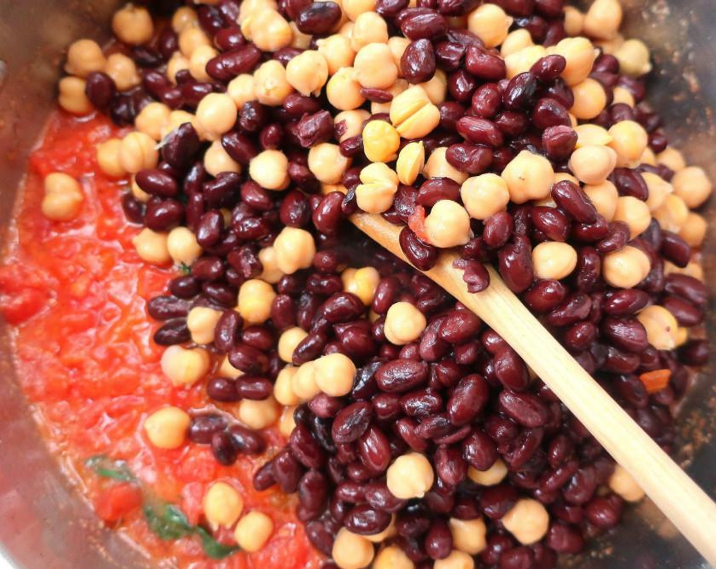 step 5 Add GOYA® Chick Peas (1 1/2 cups),  GOYA® Black Beans (1 1/2 cups) and Chicken Stock (1 cup). Season with Ground Cumin (to taste), Fresh Oregano (to taste), Cayenne Pepper (to taste) and Kosher Salt (to taste).