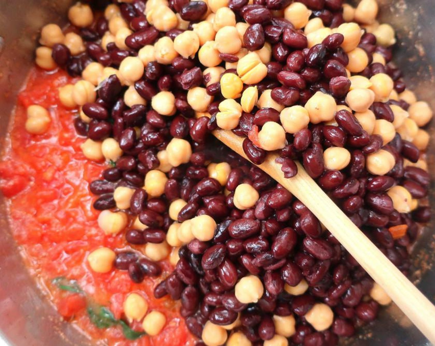 step 5 Add Canned Chickpeas (1 1/2 cups),  Canned Black Beans (1 1/2 cups) and Chicken Stock (1 cup). Season with Ground Cumin (to taste), Fresh Oregano (to taste), Cayenne Pepper (to taste) and Kosher Salt (to taste).