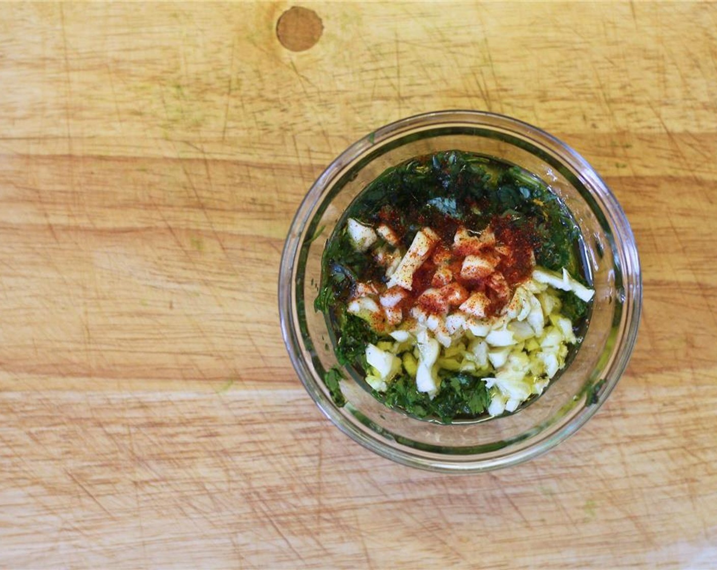 step 2 In a small bowl, mix the Fresh Cilantro (1/4 cup), Garlic (4 cloves), Scallion (1/4 cup), Fresh Ginger (1/2 tsp), Salt (1/2 tsp), Cayenne Pepper (1/4 tsp), juice from Lemon (1) and Olive Oil (1 1/2 Tbsp) to make the marinade for the salmon.