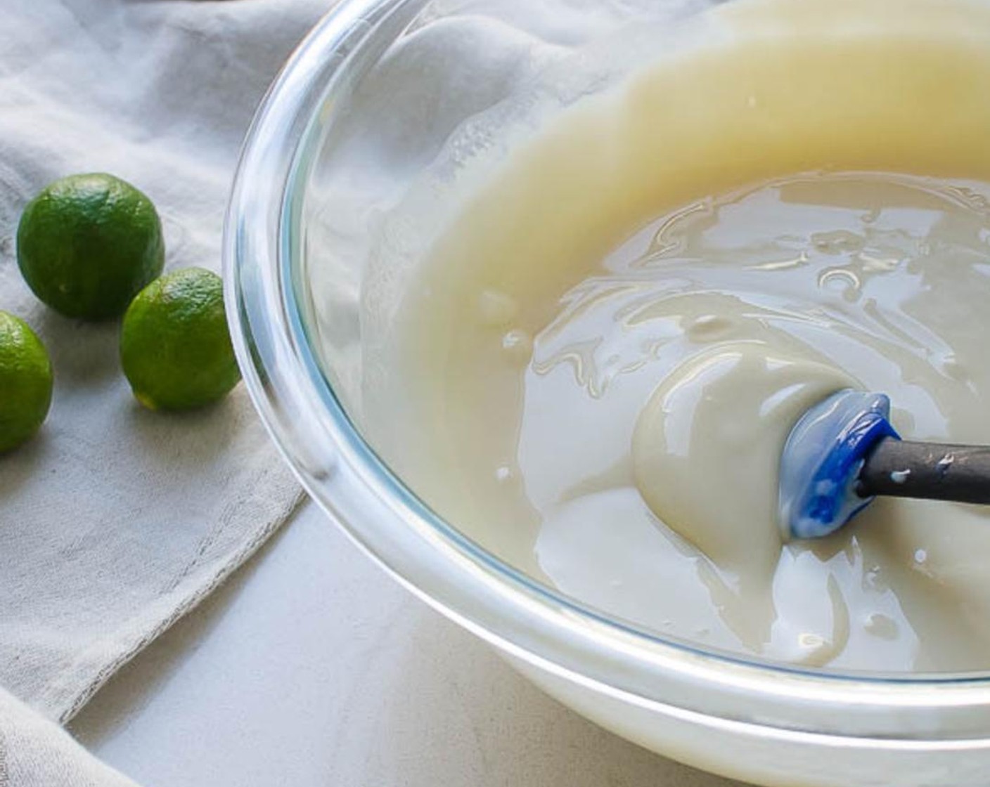 step 4 In a large bowl, combine the Sweetened Condensed Milk (1 1/3 cups) and juice from Key Limes (18). Stir until thick and well incorporated. Set aside.