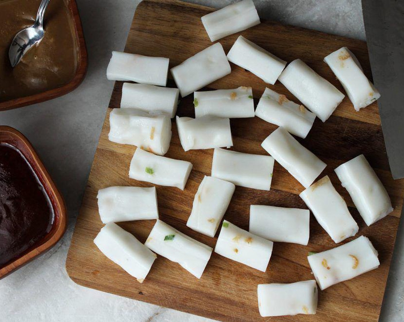 step 3 Remove the Rice Noodle Rolls (1 pckg) from the packaging and separate them into individual sticks. Cut them into small 1 inch pieces.