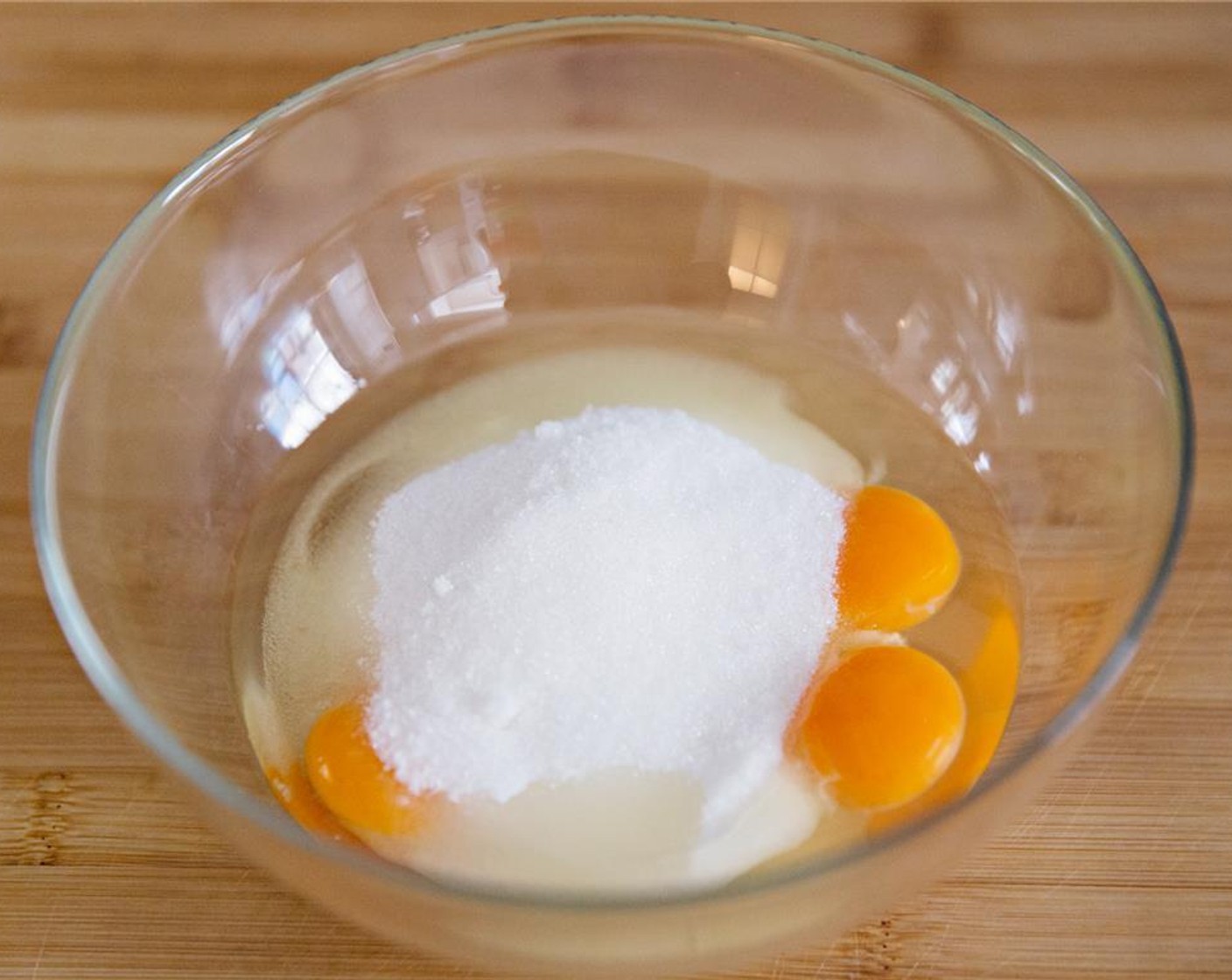 step 2 While the milk mixture is coming up to a boil, whisk the Caster Sugar (1 cup) and Eggs (3) together.
