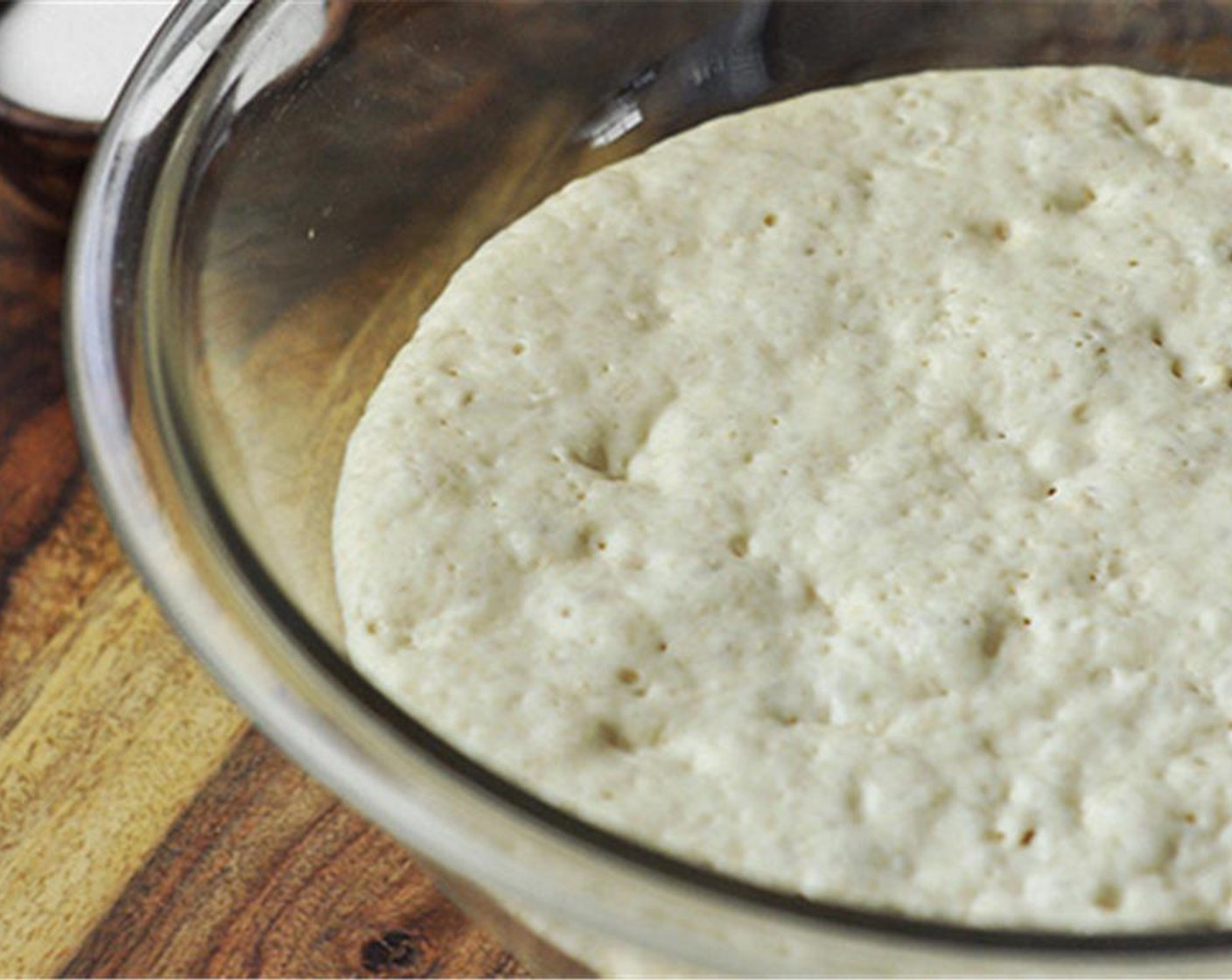 step 2 Cover the dough with plastic wrap, and let it rest in a warm place for 30 minutes.