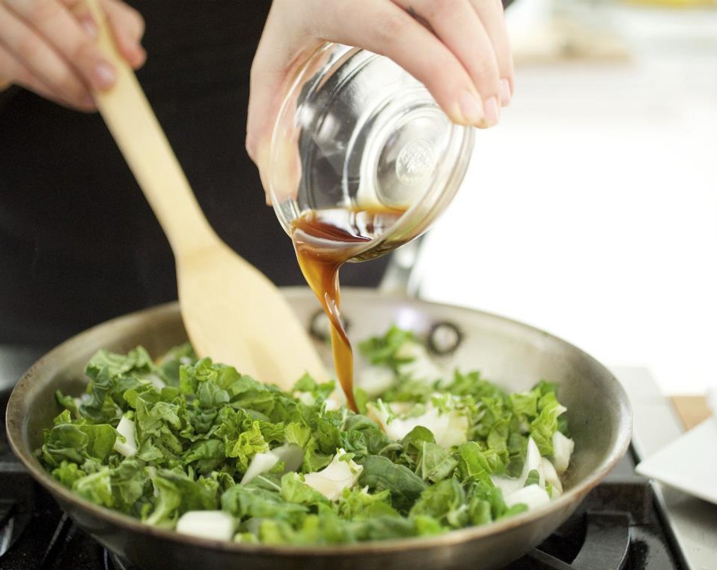 step 12 Add the ginger to the pan and sauté for 30 seconds. Add the choy sum and turn the heat to medium-high. Add the sugar mixture and Oyster Sauce (2 Tbsp) to the pan, then toss to incorporate while cooking for 1 minute.