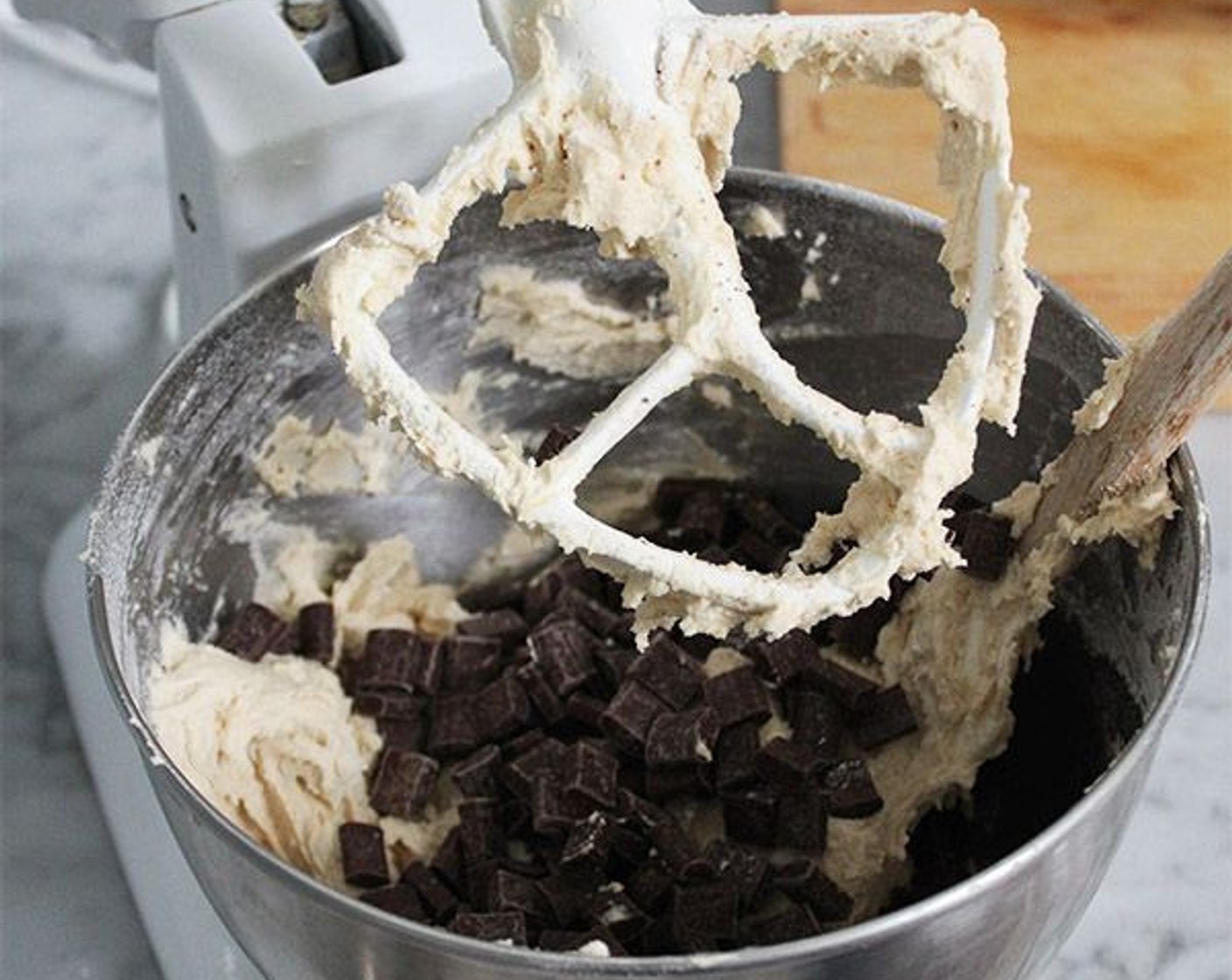 step 4 In a small bowl, whisk together the All-Purpose Flour (2 1/2 cups), Corn Starch (1/2 Tbsp), Baking Soda (1 tsp) and Kosher Salt (1 tsp). With the mixer on low, add the dry ingredients to the butter and mix until just incorporated, then add the Semi-Sweet Chocolate Chips (2 cups) and mix until just combined.