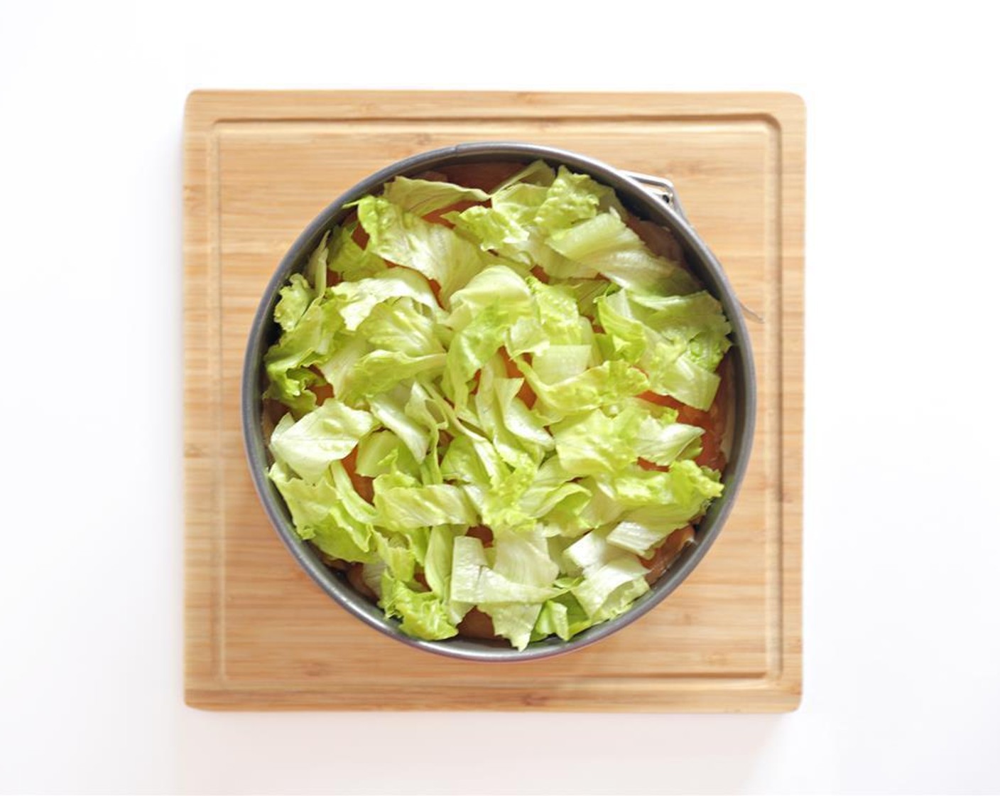 step 5 Top smoked salmon with thinly sliced Romaine Lettuce (8 pieces).