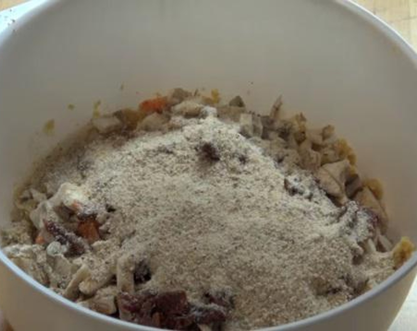 step 1 Into a bowl, add the Canned Chickpeas (2 cups) and gently mash them with a spoon. To that, add and mix the Garlic (1 clove), Carrot (1), Button Mushrooms (3), Sun-Dried Tomatoes (1/4 cup),{@10:} Ground Coriander (1 tsp), Paprika (1/2 tsp),Breadcrumbs (1 cup), Salt (to taste) and Ground Black Pepper (to taste).