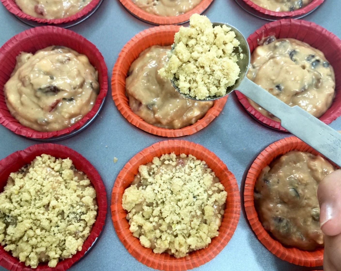 step 22 Sprinkle one heap tablespoon of the streusel on top of each muffin.