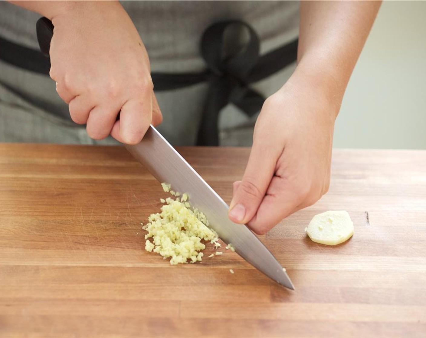 step 1 Bring eight cups of water with two teaspoons of salt to boil in a medium saucepan. Chop Garlic (3 cloves) and set aside. Peel and finely chop Fresh Ginger (2 1/3 Tbsp) and set aside.