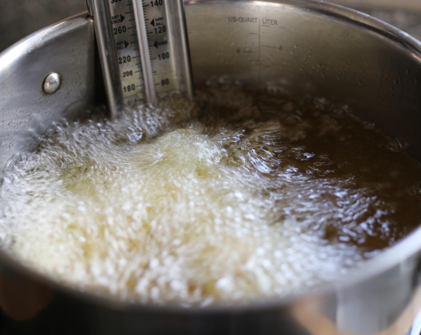 step 9 Working in batches, carefully add the coated cauliflower into the oil. Deep fry until cooked through, about 3 minutes. Repeat until all the cauliflower is cooked.