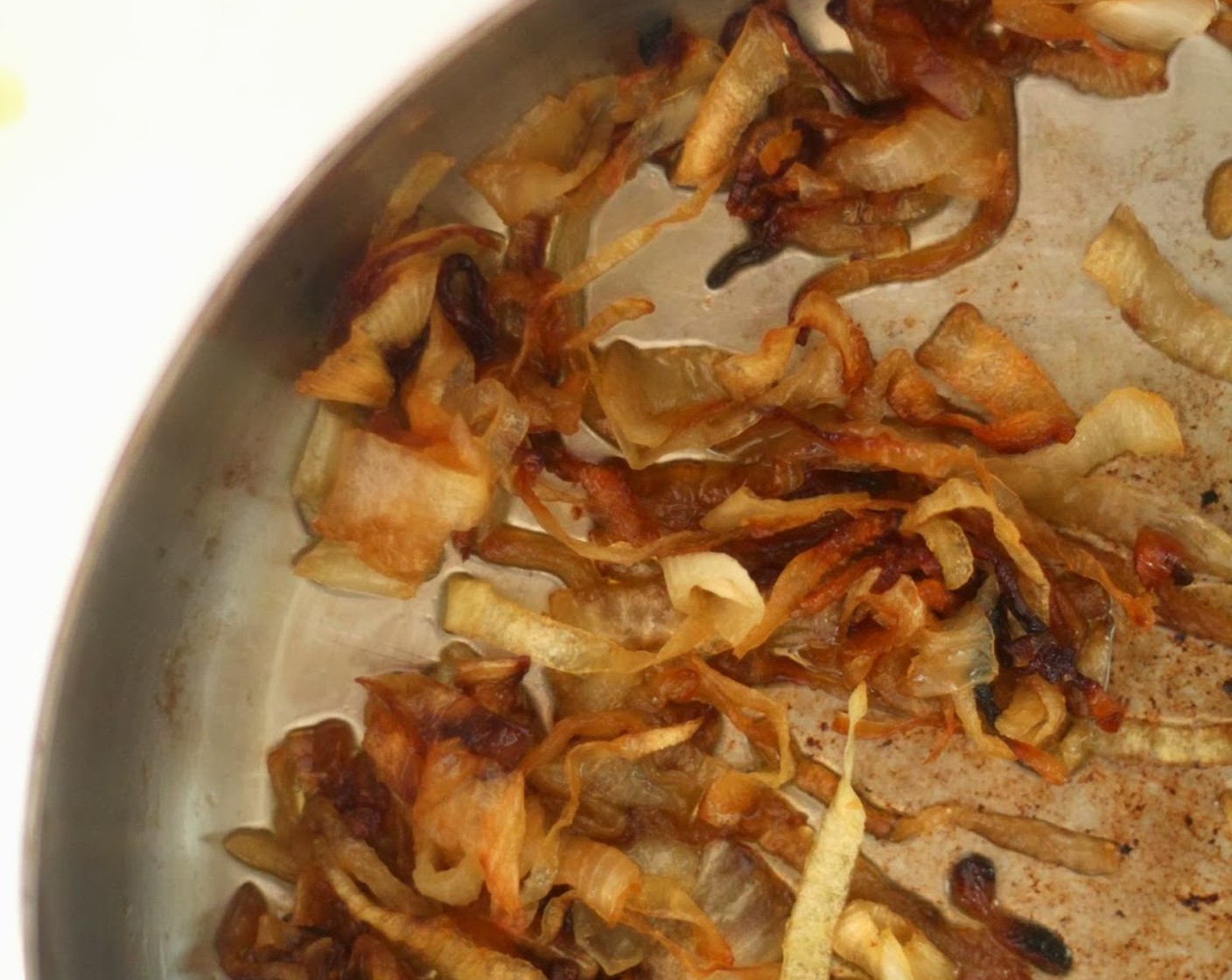 step 1 Caramelizing onions takes some time, so start by bringing a pan to medium-high heat with Olive Oil (2 Tbsp).  Add the Yellow Onion (1) and salt, but turn the heat to low. Stir regularly over low heat until caramelized, which can take up to 40 minutes. Feel free to speed up this process by cooking the onions over slightly higher heat, but expect a less caramelized effect (it will still taste great).