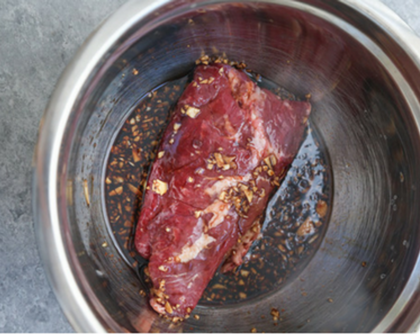 step 1 To marinate the beef, in a large zip-lock bag or bowl, combine the Gluten-Free Tamari Soy Sauce (3/4 cup), Rice Vinegar (1/2 cup), Honey (2 Tbsp), Gochujang (1 Tbsp), Fresh Ginger (1 in) Garlic (2 cloves), and Dark Sesame Oil (2 Tbsp). Add the Skirt Steak (1.5 lb) and toss to coat. Marinate for at least 30 minutes, or overnight.