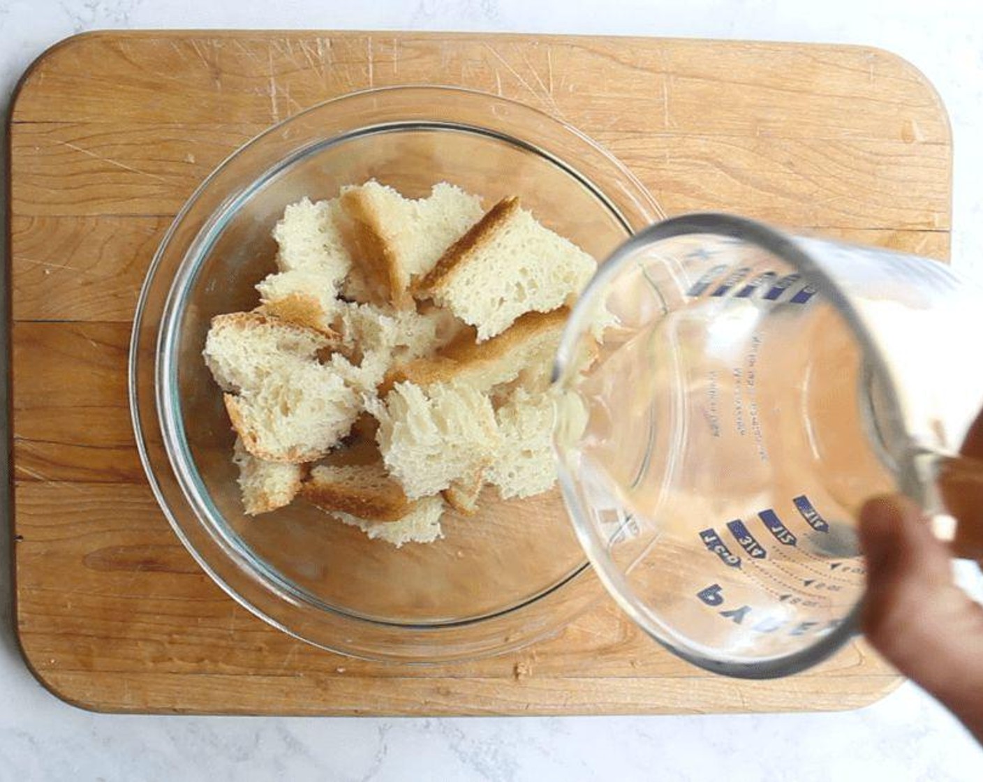 step 2 Meanwhile, in a small bowl, pour Water (1/3 cup) over the Bread (2 slices). Let it sit until it softens, about 10 minutes.