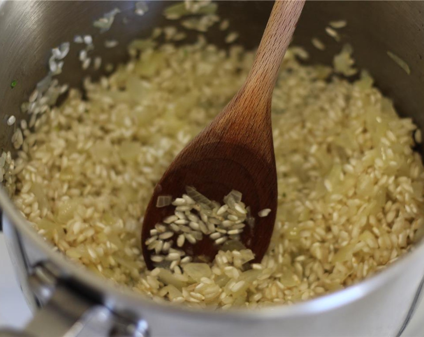 step 10 Add in the Arborio Rice (1 cup). Cook for a few minutes, stirring often, until the rice is toasty.
