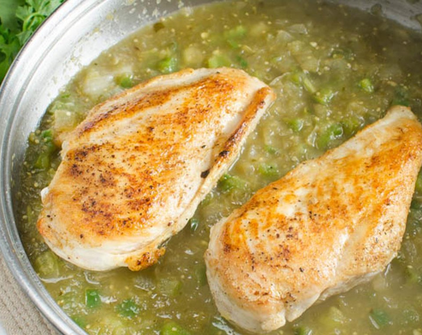 step 6 Add the organic chicken breasts back to the pan, cover tightly with lid and reduce heat to medium-low. Simmer for 10 minutes until organic chicken breasts are cooked through.
